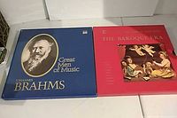 Front view of both box sets: blue Brahms and red Baroque Era