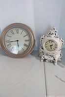 Both clocks side by side showing size and style