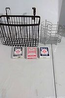 Full lot showing black hanging basket, silver wire organizer, three card decks