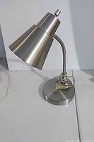 Full view of chrome desk lamp, gooseneck and shade