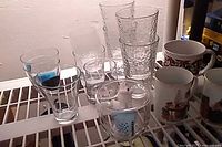 Mixed lot showing clear pebbled tumblers, other glasses and mugs