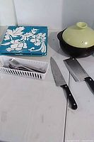 Entire lot showing platters, cutlery tray, casserole dish, knives
