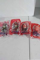 All four sealed Happy Meal toys lined up