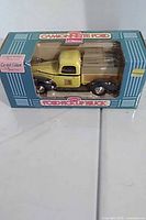 Boxed die-cast 1940 Ford pickup truck coin bank front view