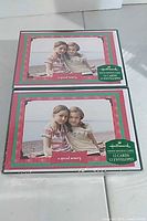 Front view of two sealed Hallmark photo holder card boxes