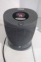 Front view showing display, controls, grille