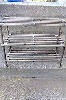 Front view of wood slatted shoe rack