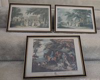 Three framed prints displayed together on stairs