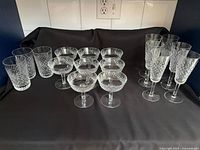 Group shot of all 17 Waterford Alana glasses: 3 tumblers, 8 coupes, 6 flutes