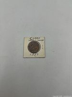 Obverse of 1857 Bank of Upper Canada half penny token in cardboard flip