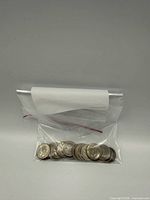 Bag containing 25 American dimes front view