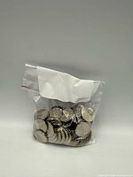Front view of bag filled with Canadian nickels