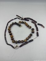 Tiger's-eye round beads with maroon cylindrical bead necklace strands