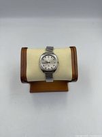 Front view of Bucherer wristwatch on stand showing dial and bracelet