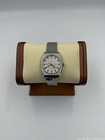 Front view of Citizen automatic watch on display stand