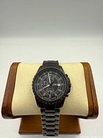 Front view of Fossil chronograph watch on display stand