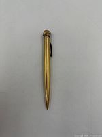 Full view of gold filled pen-style lighter