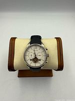 Front view of Heritor wristwatch on stand showing dial and leather strap