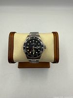 Front view of Jerome Lemars stainless steel automatic watch on stand