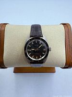 Front view of Le Jour watch on stand