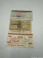 Fronts of three Italian banknotes 200, 50, 100 Lire