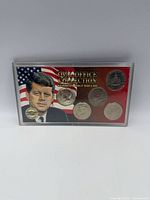 Front of Oval Office Collection holder showing portrait background and five Kennedy half dollars