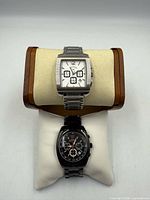 Front view showing both Callaway watches on display cushions