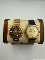 Front view of both Caravelle watches on display stand