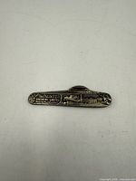 Front of metal pocket knife showing The Kuntz Brewery Limited Waterloo Ont engraving