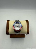 Front view of Seapro Scuba 200 watch on stand showing bezel and bracelet