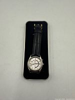 Front view of Seiko Kinetic watch in box