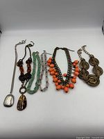 All six necklaces laid out for group view