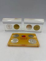 Front view of both acrylic blocks and Taiwan coin set