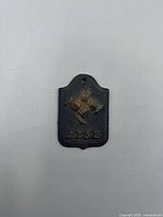 full view of cast iron plaque showing crossed cannons and 1752