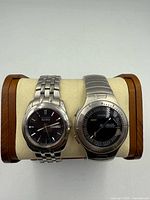 Front view of both watches on display pillow