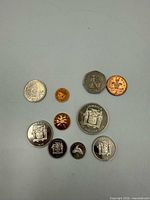 All ten coins laid out showing obverse designs