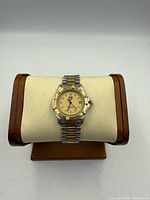 Front view of Tag Heuer Professional 2000 watch on display stand