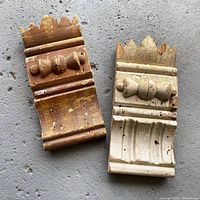 Front view of both mouldings showing carved detail and finishes