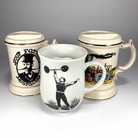 Three ceramic moustache steins front view