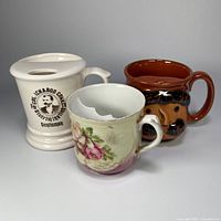 Group shot of all three moustache mugs