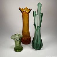 Group shot of all three swung glass vases showing relative sizes and colors
