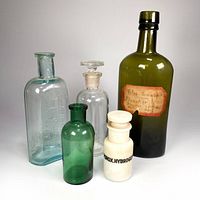 Group shot of all five vintage bottles