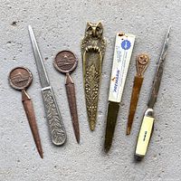 All seven letter openers laid out