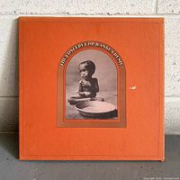 Front of orange slipcase box for The Concert for Bangladesh