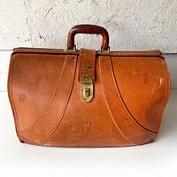 Full view of closed brown leather Langmuir briefcase showing overall condition