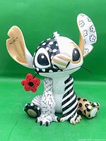 Front view of Stitch figurine displaying overall design and colors