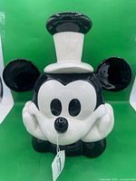 Front view of Mickey Mouse Steamboat Willie ceramic cookie jar with tag attached