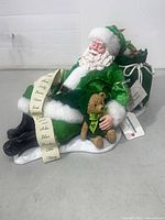 Full view of Santa figurine with sack and tag attached