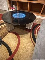 Top view showing glass surface and illuminated infinity mirror center