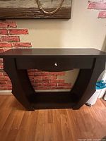 Front view of dark brown console table